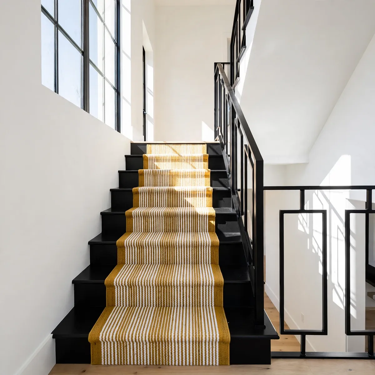 black staircase ideas: Black Steps Against Crisp White Walls