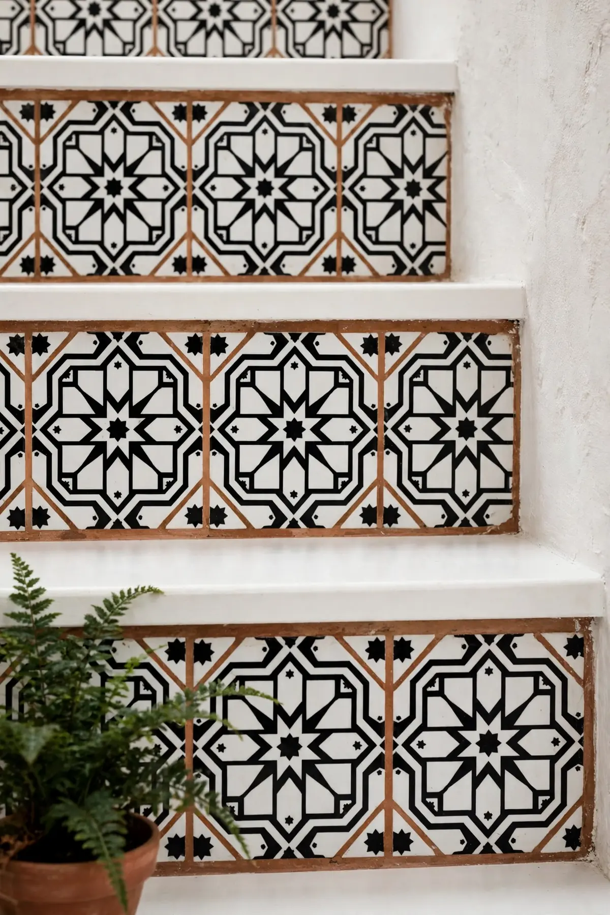 25 Black and White Staircase Ideas That Always Look Expensive black and white staircase ideas: Patterned Black-and-White Tile on the Risers